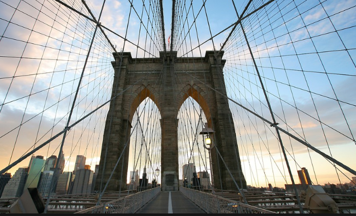  Leave room in your business class flight itinerary to walk across the Brooklyn Bridge and check out trendy Brooklyn. - IFlyFirstClass